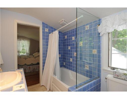 1 Allwood Road Darien, CT 06820 - Photo 19 of 20 a bathroom with a tub sink and mirror