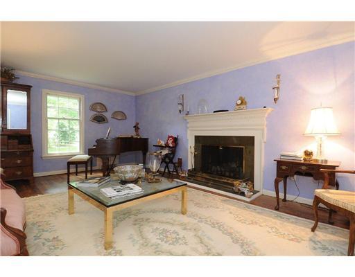 1 Allwood Road Darien, CT 06820 - Photo 2 of 20 a living room with furniture a fireplace and a large window