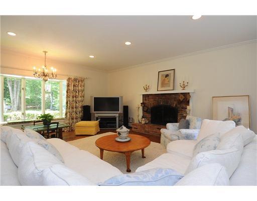 1 Allwood Road Darien, CT 06820 - Photo 5 of 20 a living room with furniture a fireplace and a flat screen tv