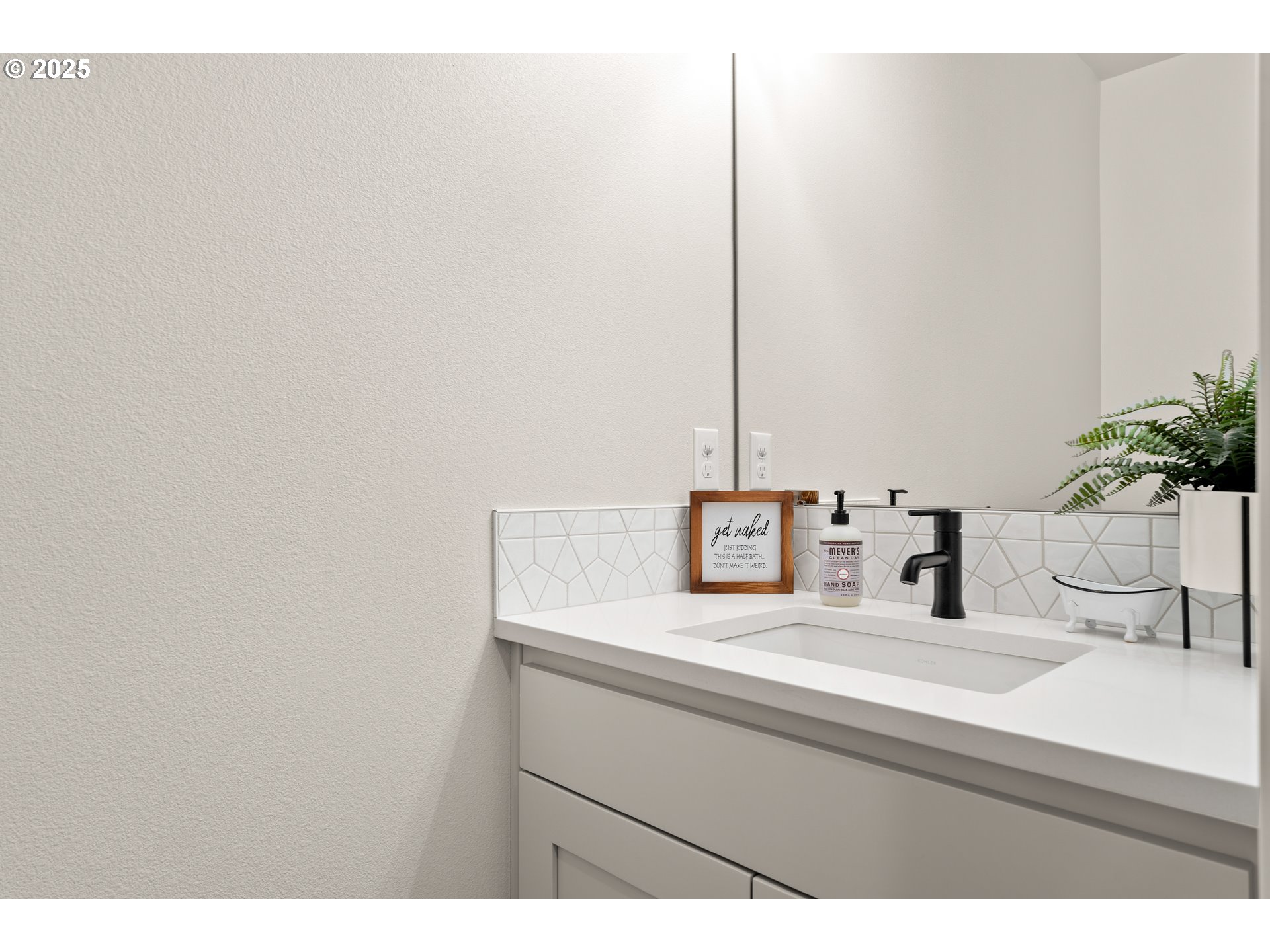 20211 Glen Vista Road Bend, OR 97703 - Photo 14 of 32 a bathroom with a sink and a mirror