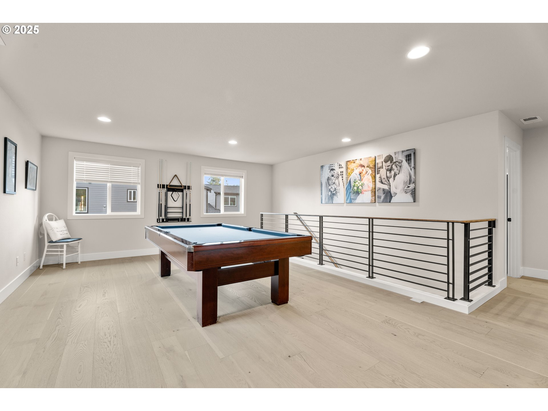 20211 Glen Vista Road Bend, OR 97703 - Photo 16 of 32 a living room with furniture and a wooden floor