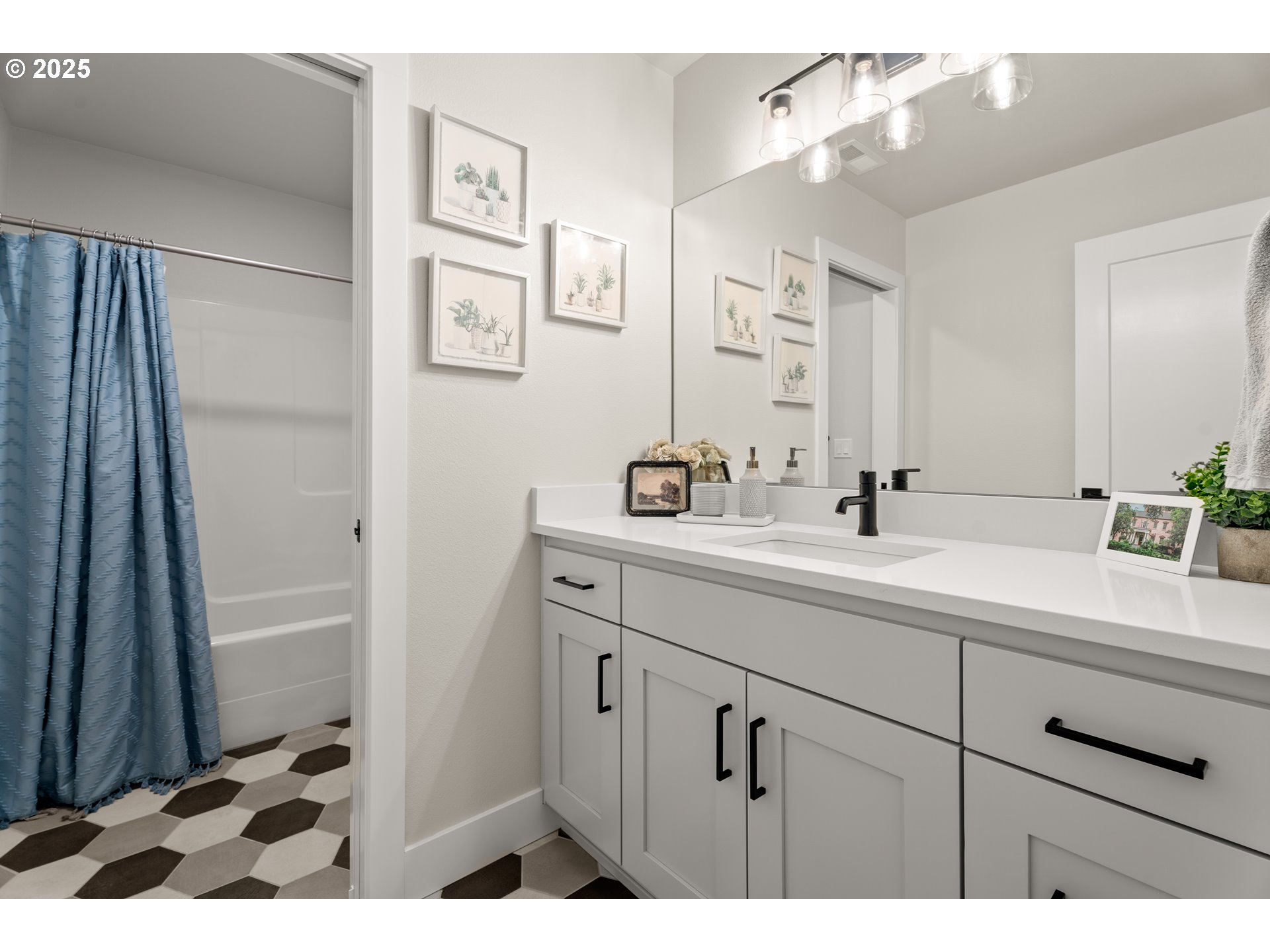 20211 Glen Vista Road Bend, OR 97703 - Photo 19 of 32 a bathroom with a sink a mirror and a shower