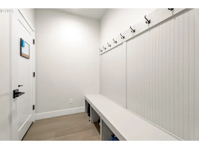 a spacious bedroom with a bed and a large window