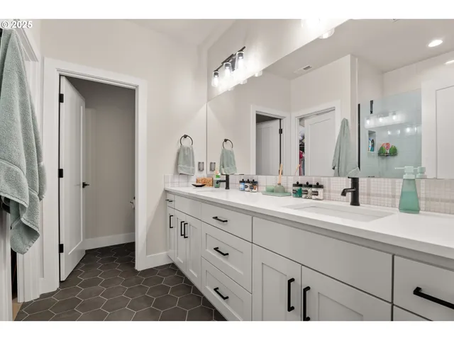 a spacious bedroom with a bed and a desk