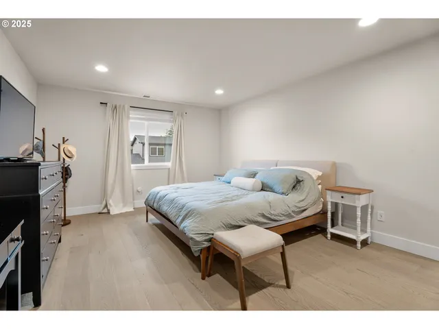 a bathroom with a double vanity sink mirror and bathtub