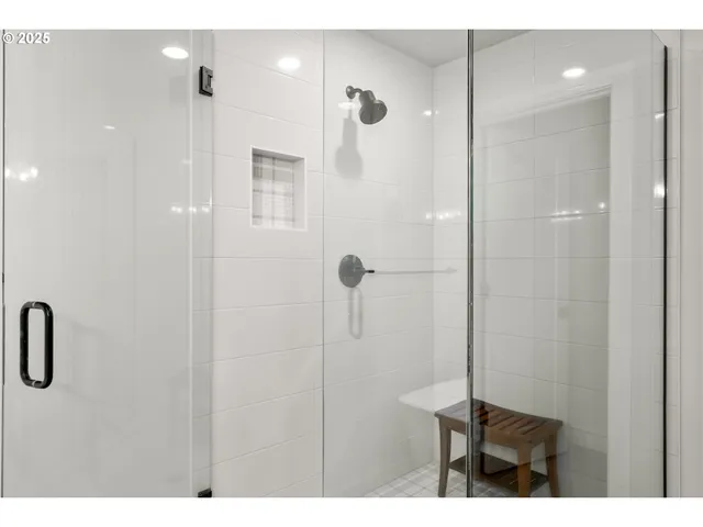 a bathroom with a shower and a sink
