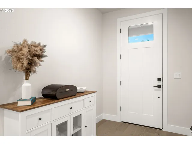 a kitchen with a sink cabinets and window