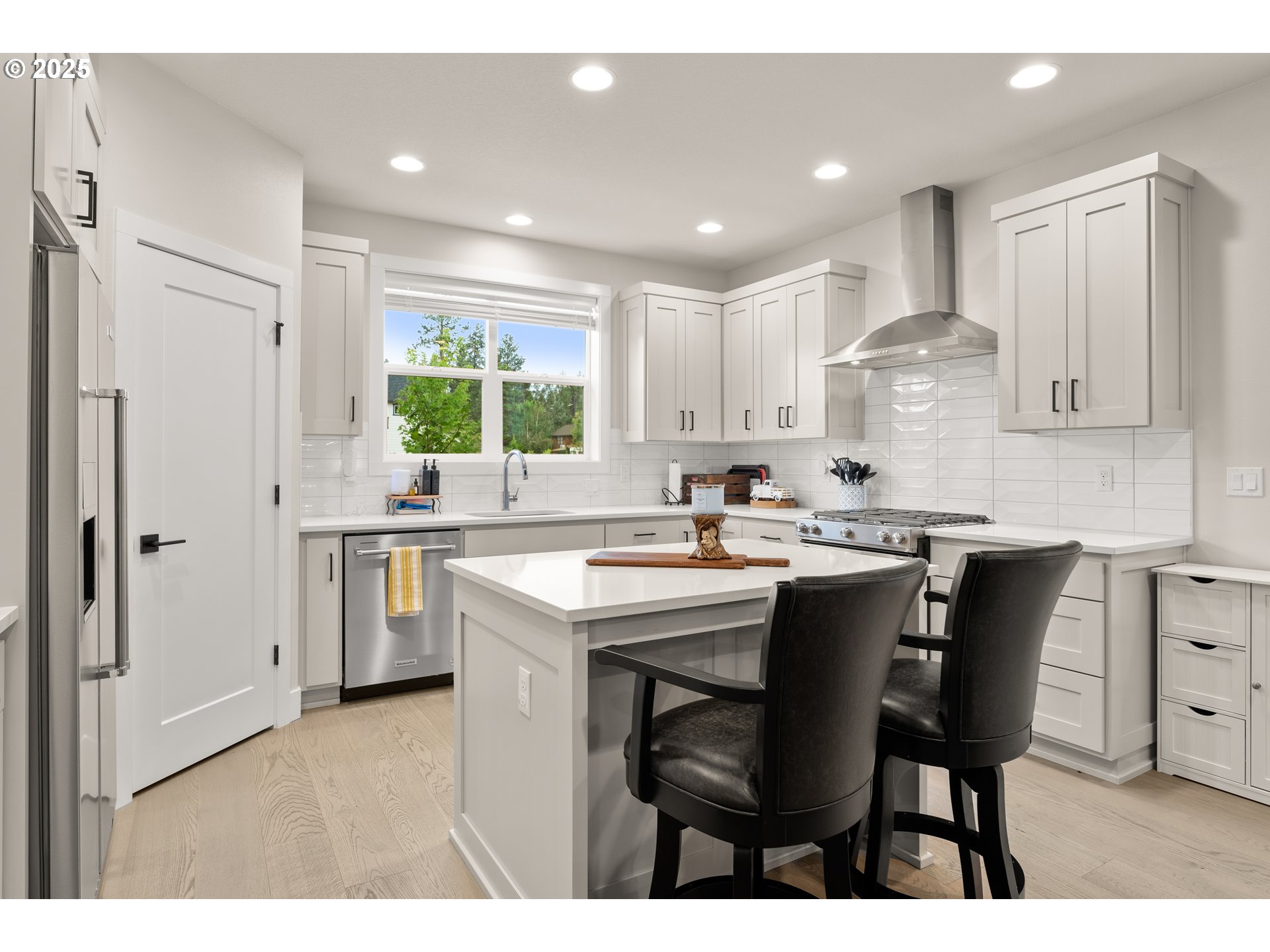 20211 Glen Vista Road Bend, OR 97703 - Photo 5 of 32 a kitchen with a sink cabinets and window