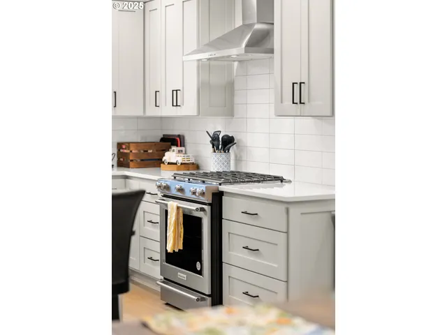 a view of a dining room with furniture and a fireplace