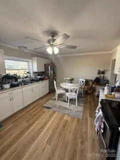 a living room with stainless steel appliances kitchen island granite countertop furniture and a kitchen view