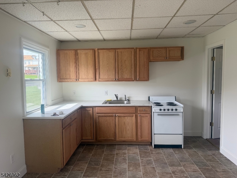 630 Dewey Avenue, Unit B Alpha, NJ 08865 - Photo 2 of 6 a kitchen with stainless steel appliances granite countertop a sink stove and cabinets