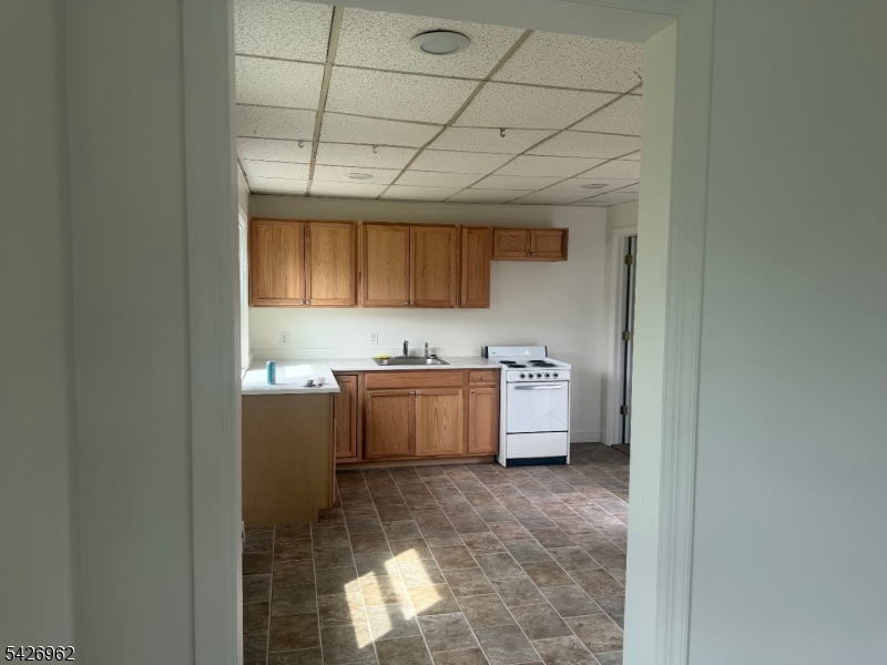 630 Dewey Avenue, Unit B Alpha, NJ 08865 - Photo 3 of 6 a view of a kitchen with a sink and cabinets