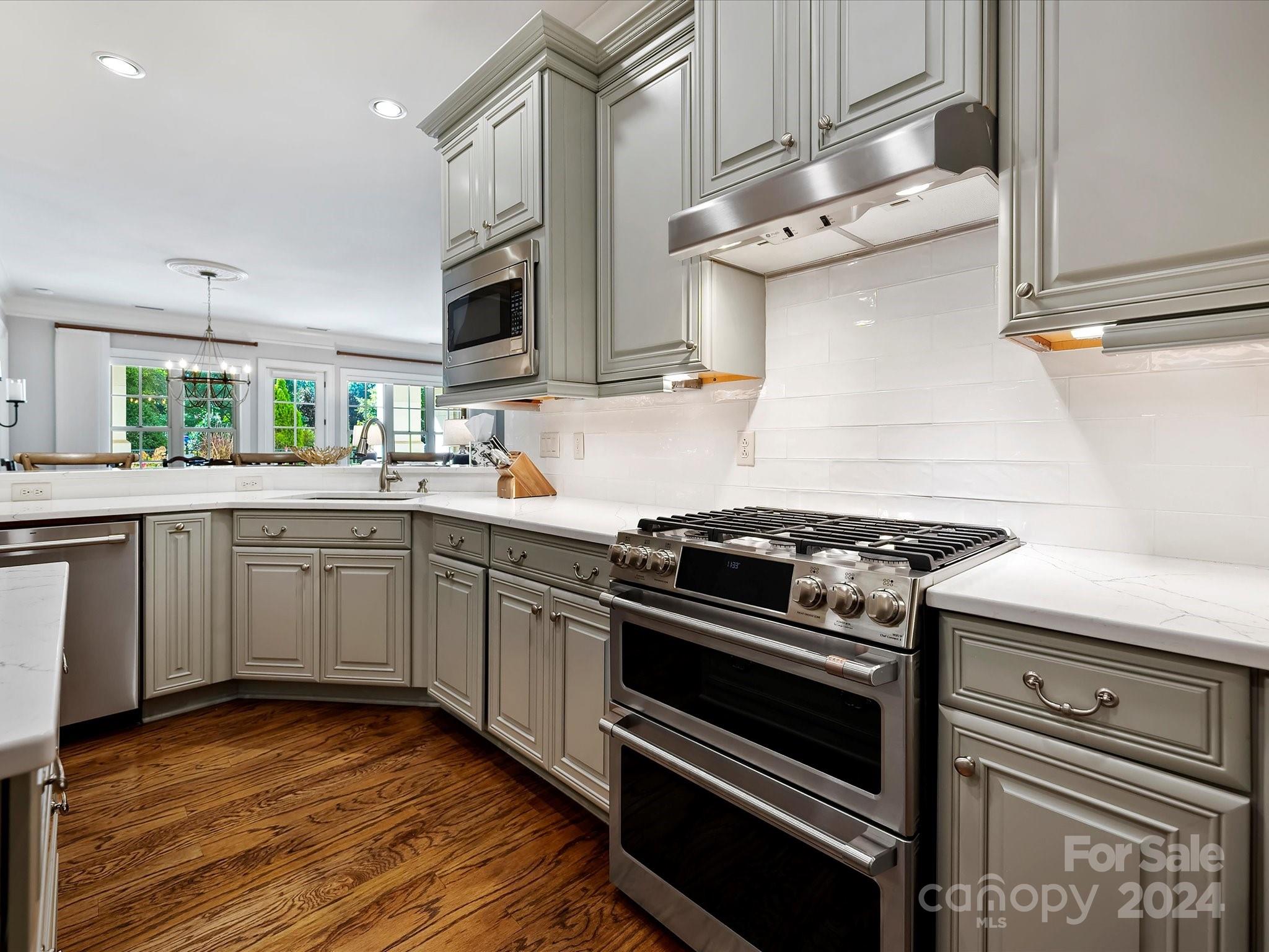2823 Providence Road, Unit 216 Charlotte, NC 28211 - Photo 15 of 35 a kitchen with stainless steel appliances a stove sink and cabinets