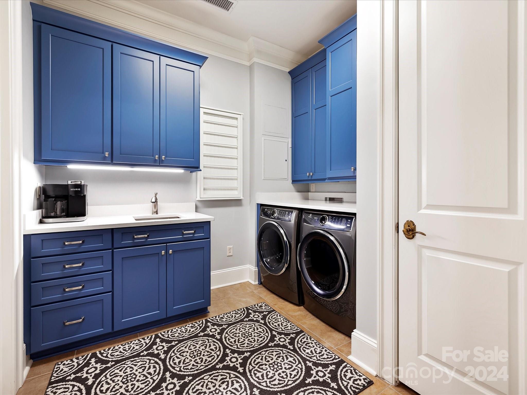 2823 Providence Road, Unit 216 Charlotte, NC 28211 - Photo 18 of 35 a utility room with sink dryer and washer