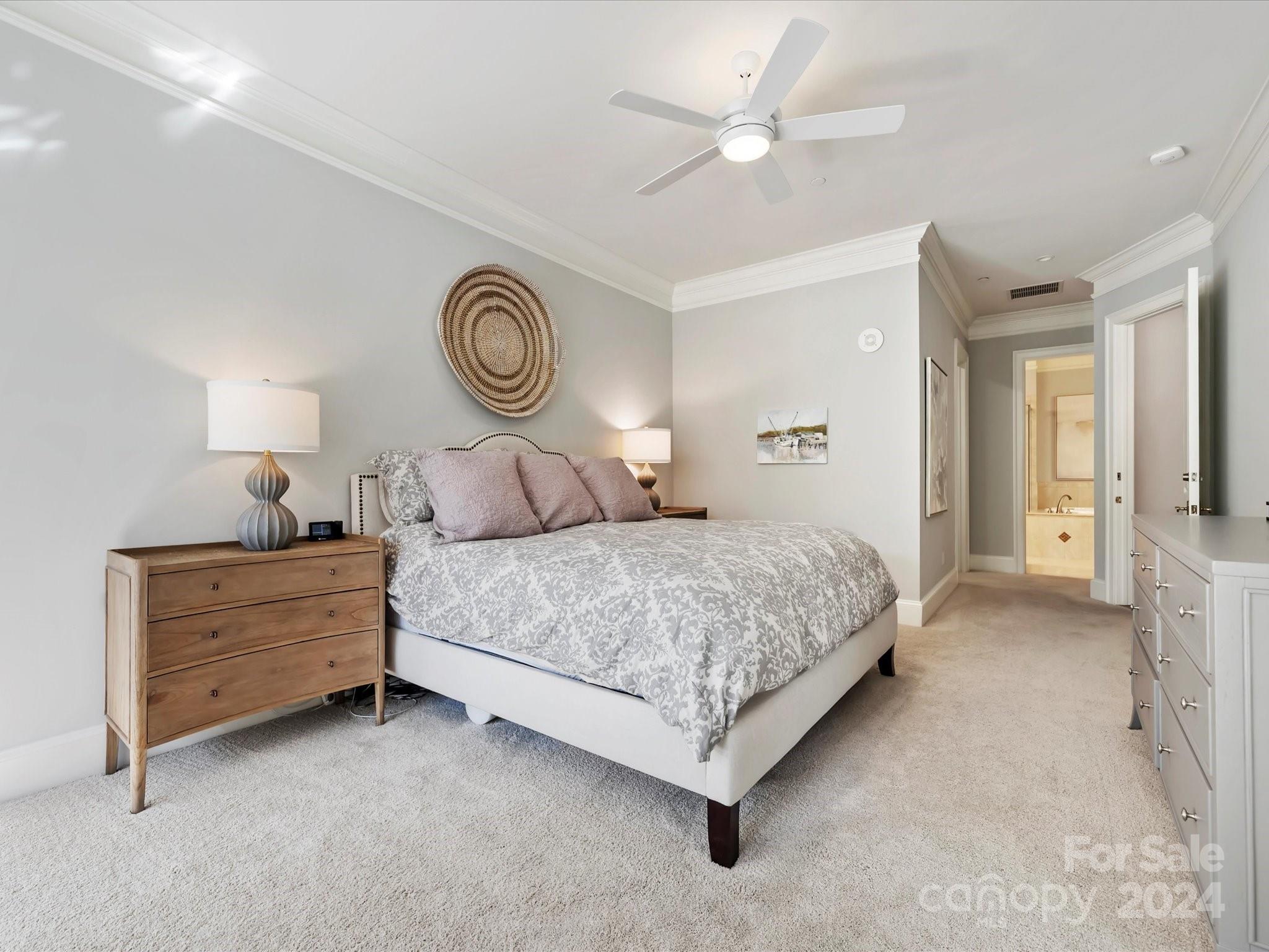 2823 Providence Road, Unit 216 Charlotte, NC 28211 - Photo 21 of 35 a bedroom with a bed and a chandelier