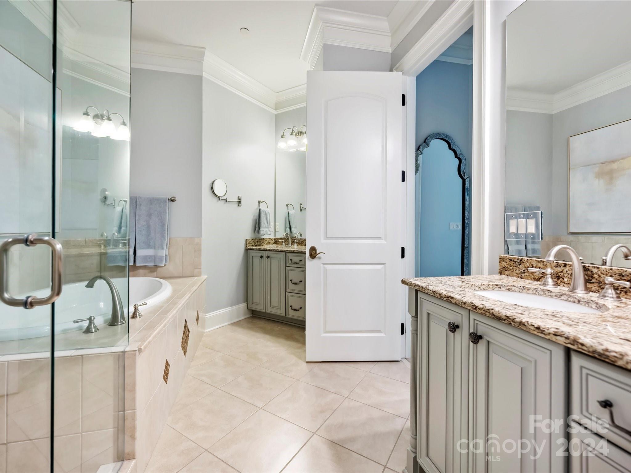 2823 Providence Road, Unit 216 Charlotte, NC 28211 - Photo 23 of 35 a spacious bathroom with a double vanity sink a mirror and a shower