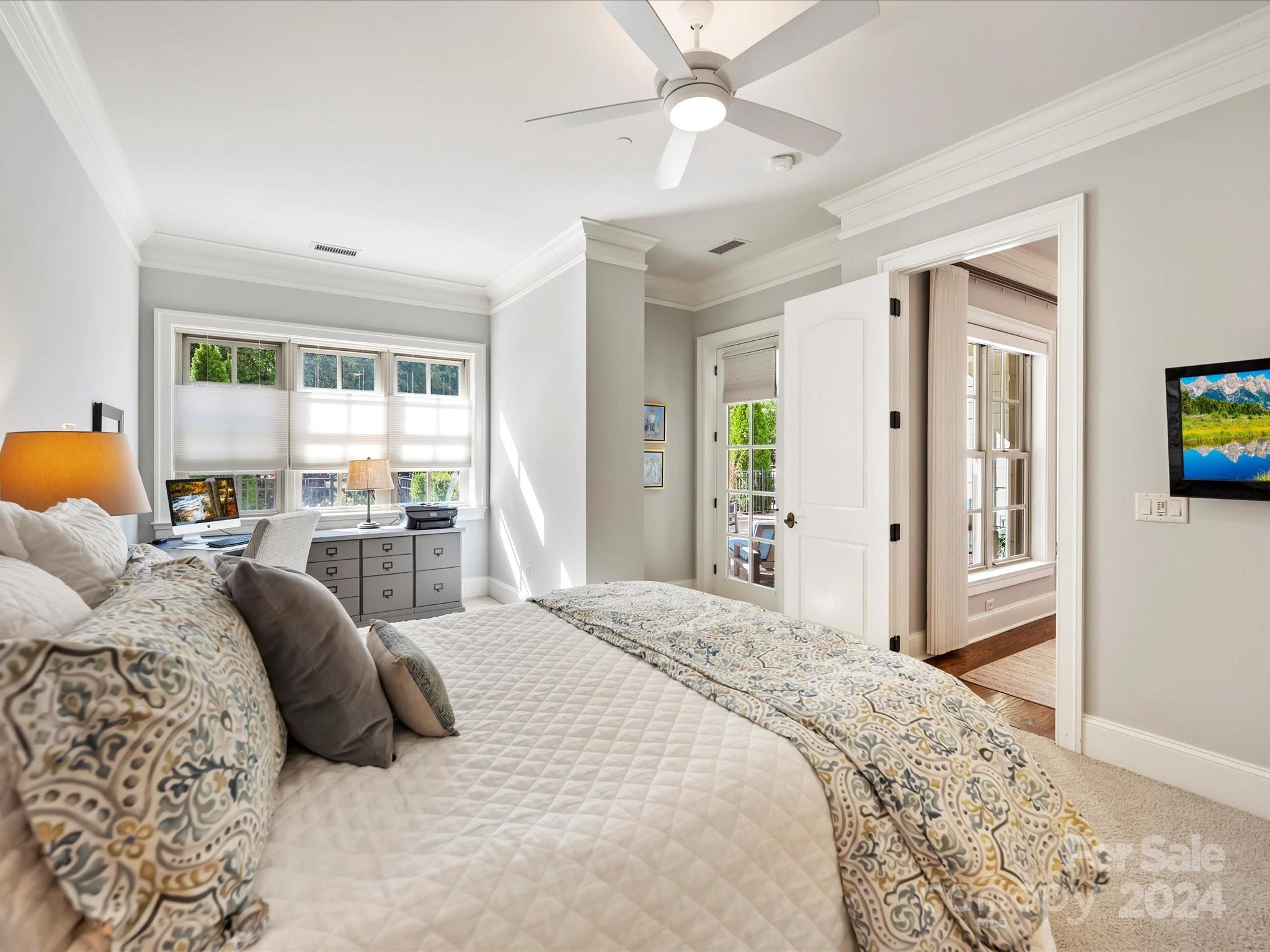 2823 Providence Road, Unit 216 Charlotte, NC 28211 - Photo 25 of 35 a bedroom with a large bed and a window