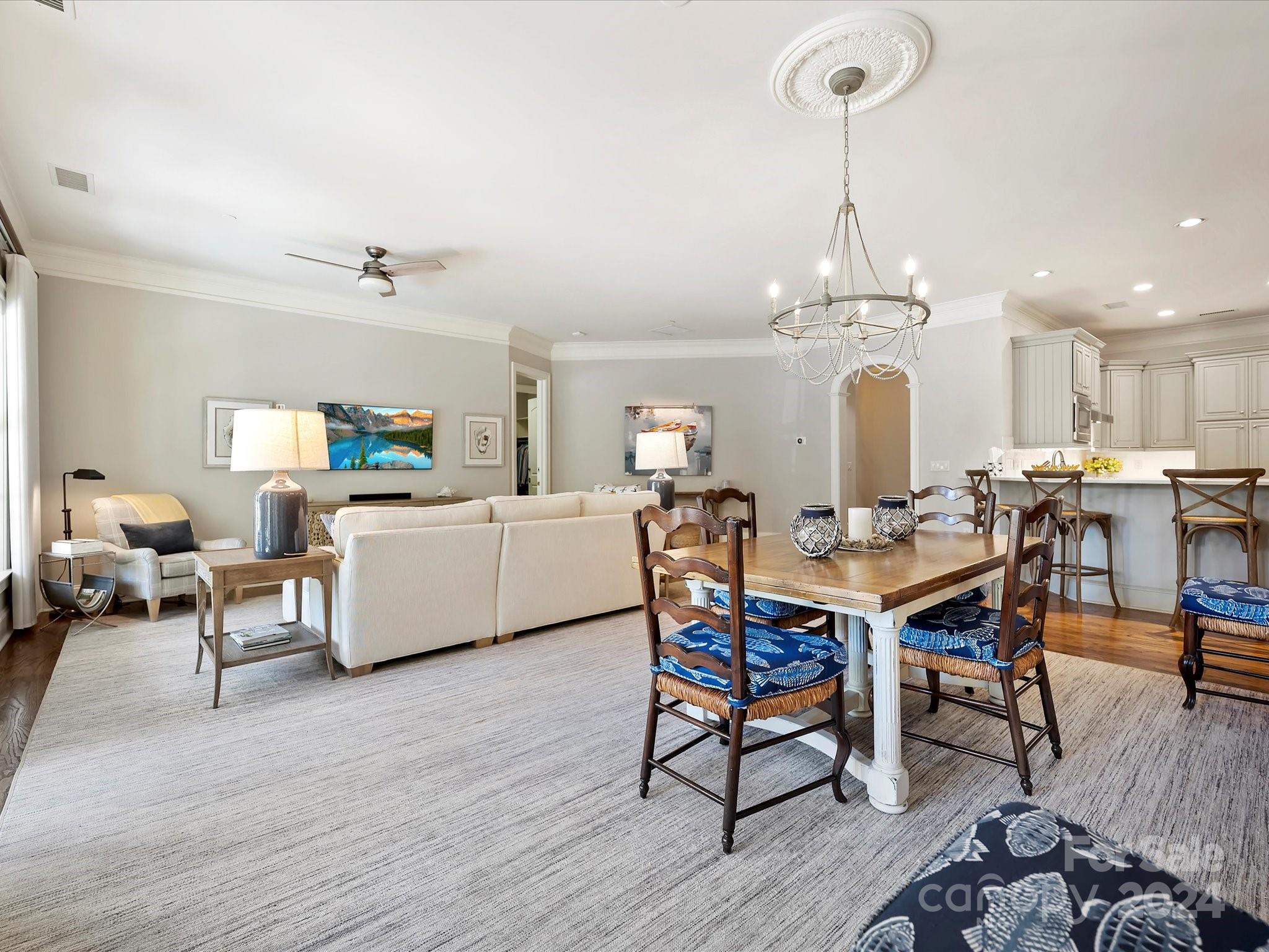 2823 Providence Road, Unit 216 Charlotte, NC 28211 - Photo 7 of 35 a view of a dining room with furniture and wooden floor