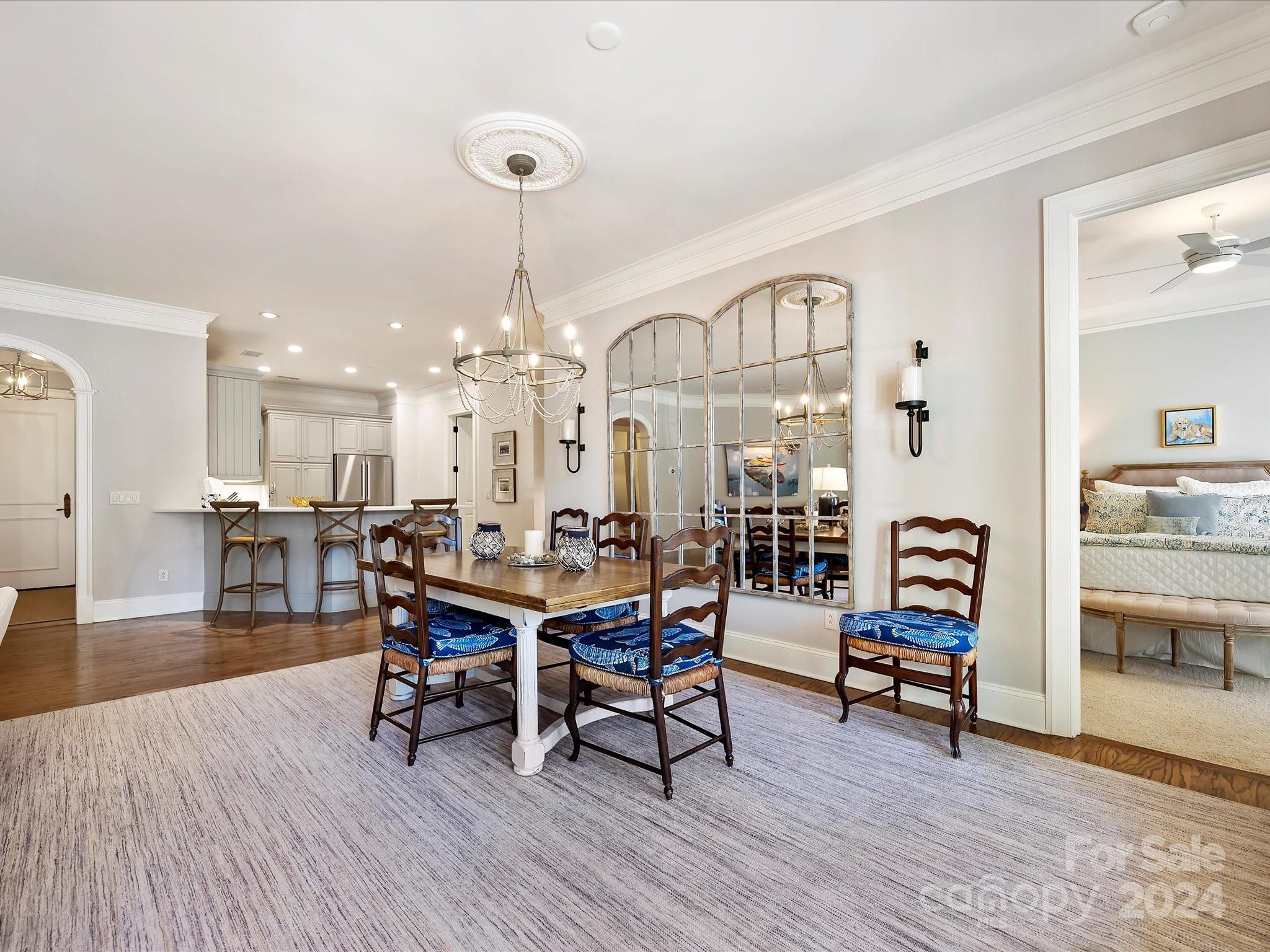 2823 Providence Road, Unit 216 Charlotte, NC 28211 - Photo 10 of 35 a view of a a dining room with furniture wooden floor and a chandelier