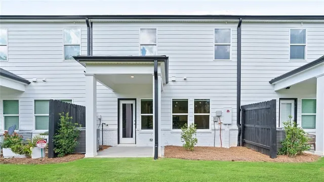 a front view of a house with a yard and porch