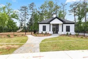 a view of a house with swimming pool and a yard