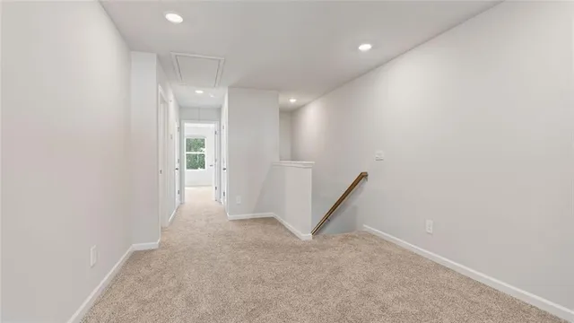 a view of a hallway with staircase