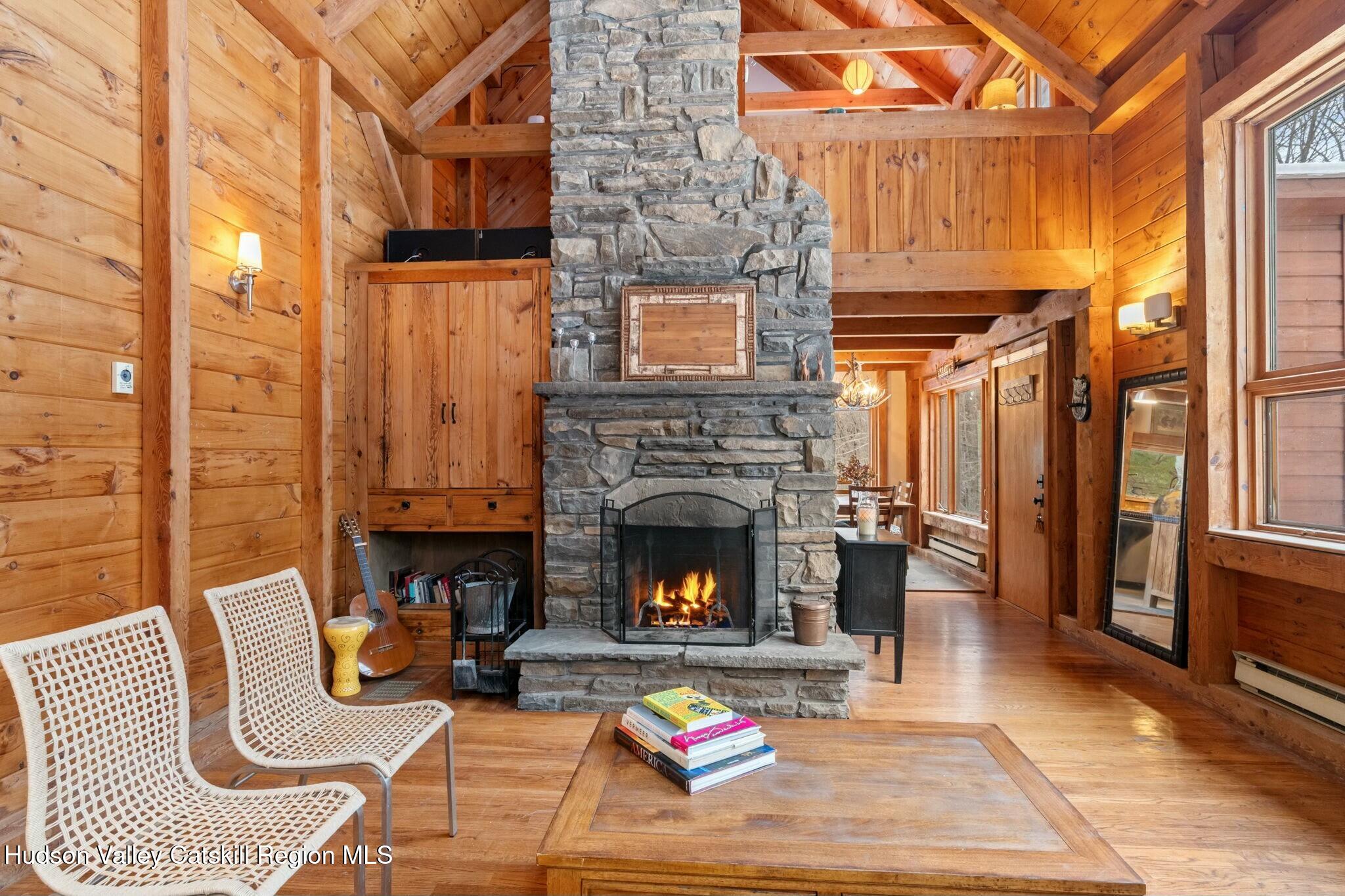 250 Macdaniel Road Woodstock, NY 12498 - Photo 12 of 39 a living room with furniture and a fireplace