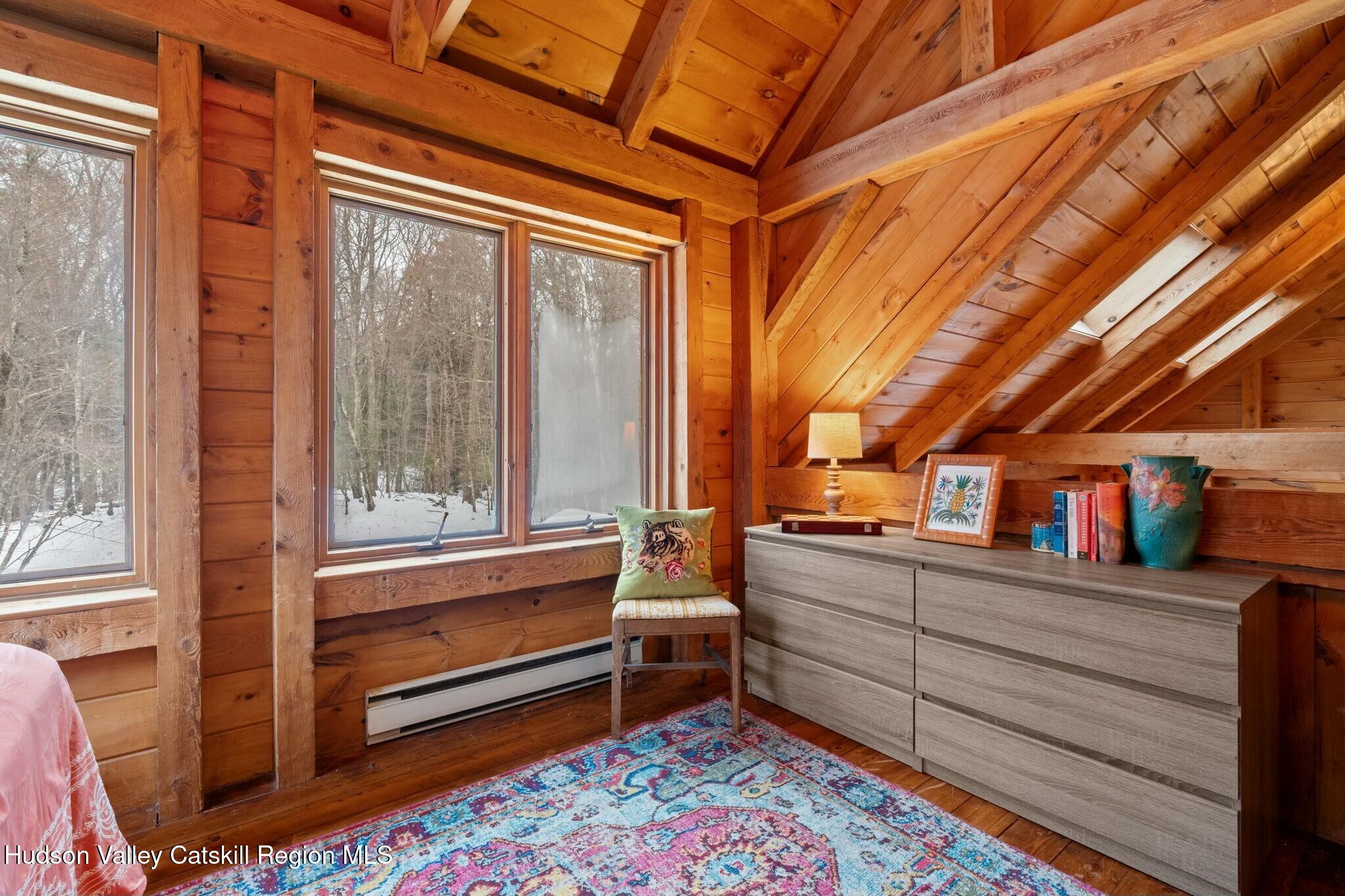 250 Macdaniel Road Woodstock, NY 12498 - Photo 22 of 39 a room with furniture and a rug
