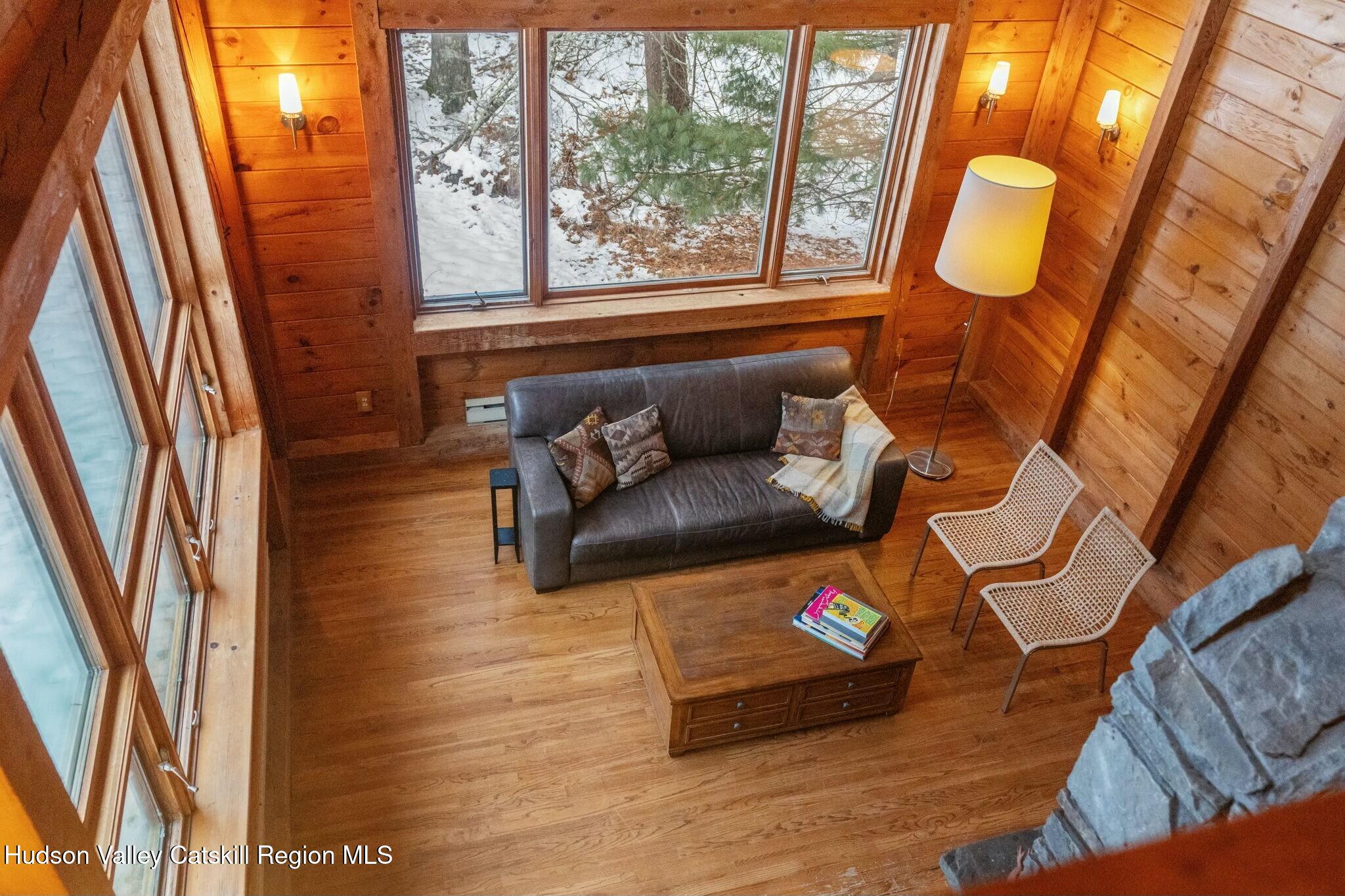 250 Macdaniel Road Woodstock, NY 12498 - Photo 24 of 39 a living room with furniture and a large window
