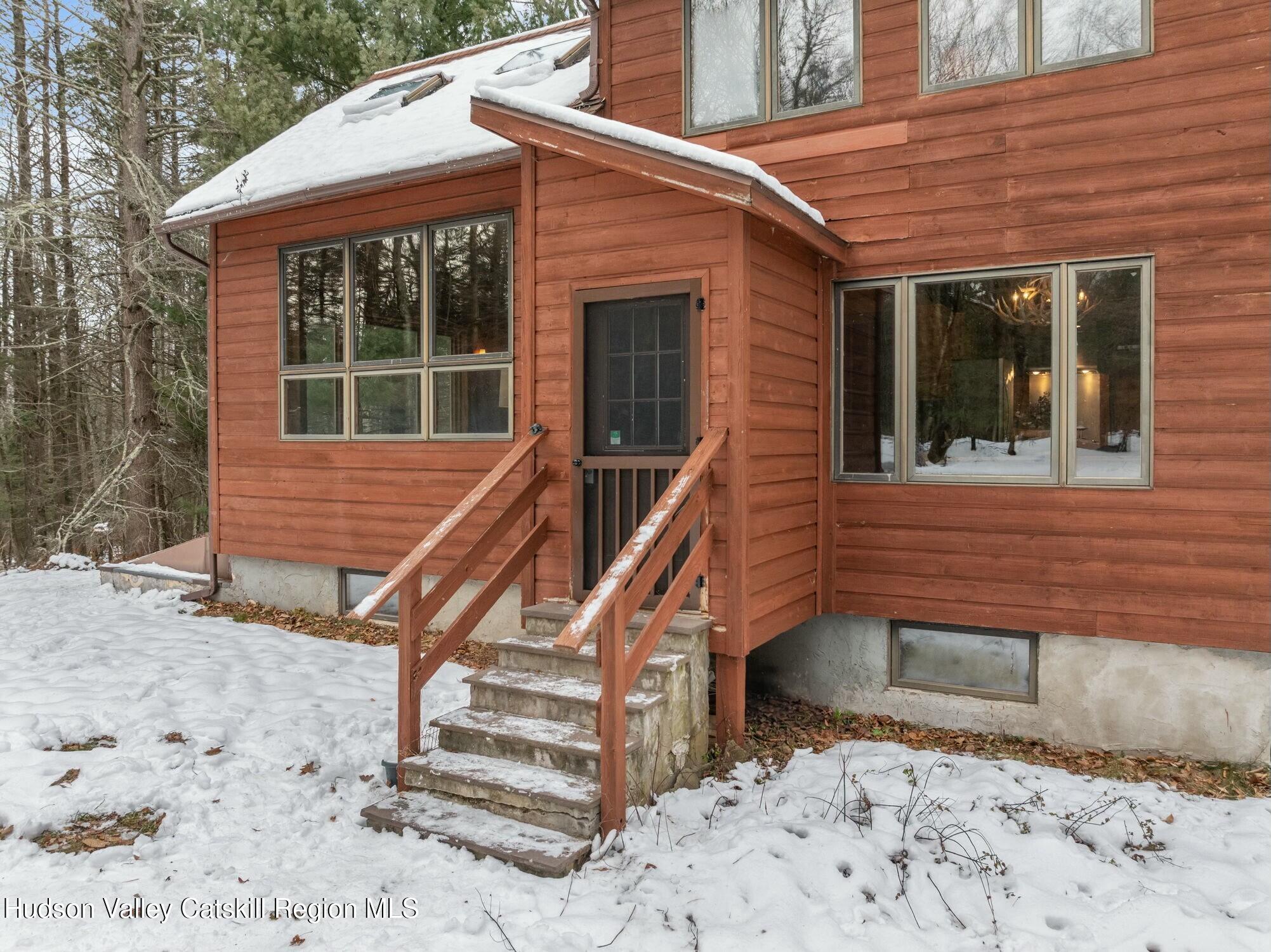 250 Macdaniel Road Woodstock, NY 12498 - Photo 3 of 39 a front view of a house with a yard