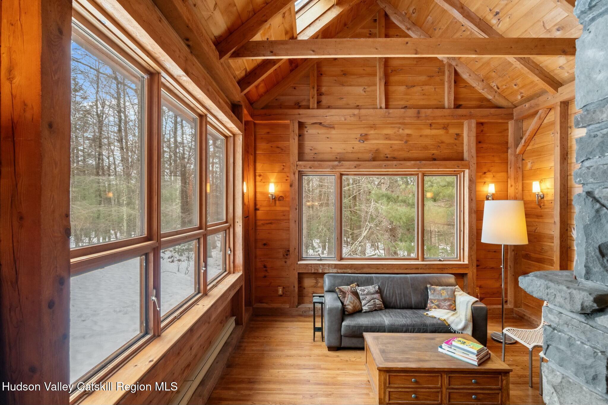250 Macdaniel Road Woodstock, NY 12498 - Photo 4 of 39 a living room with furniture and a large window