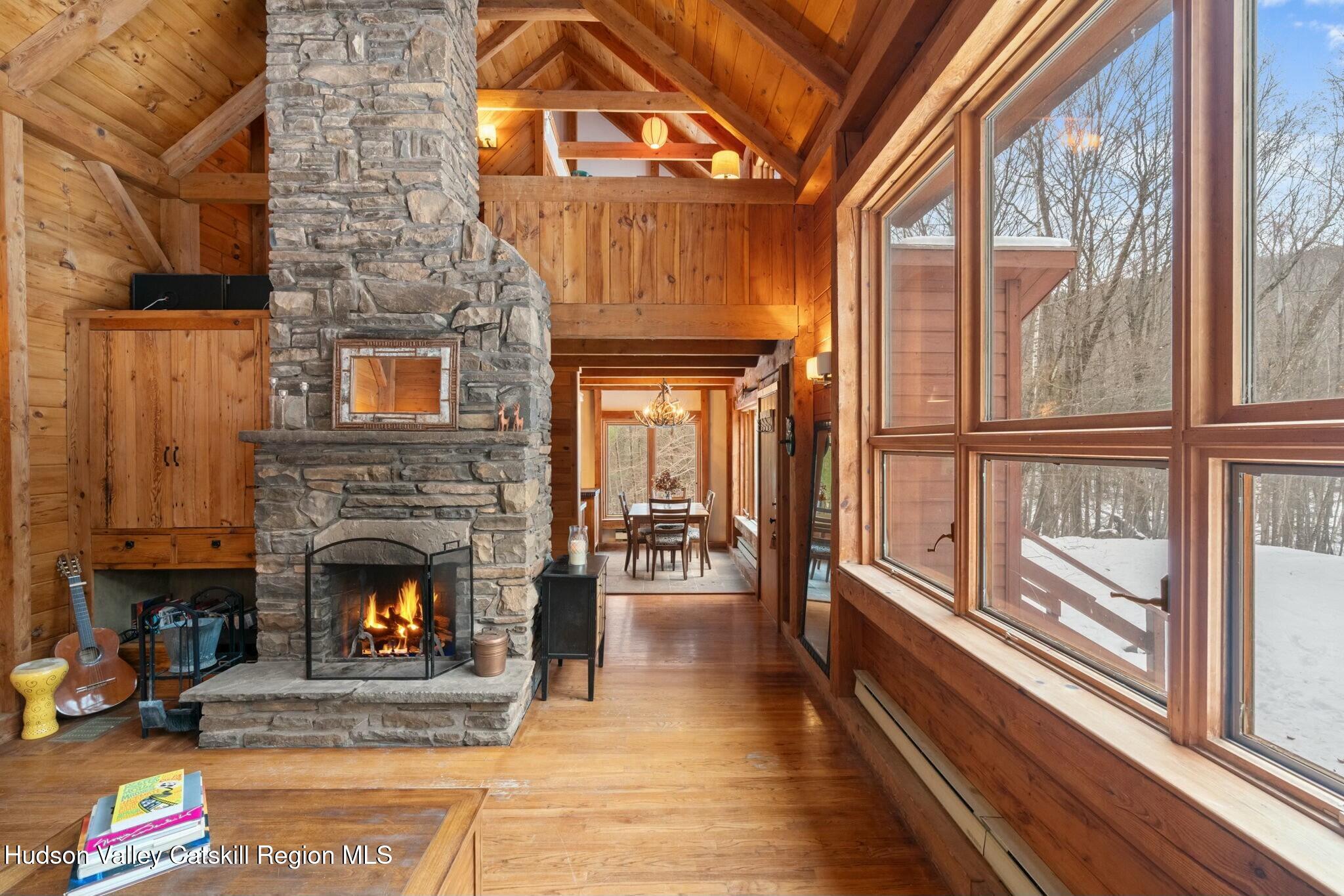 250 Macdaniel Road Woodstock, NY 12498 - Photo 6 of 39 a living room with furniture and a fireplace