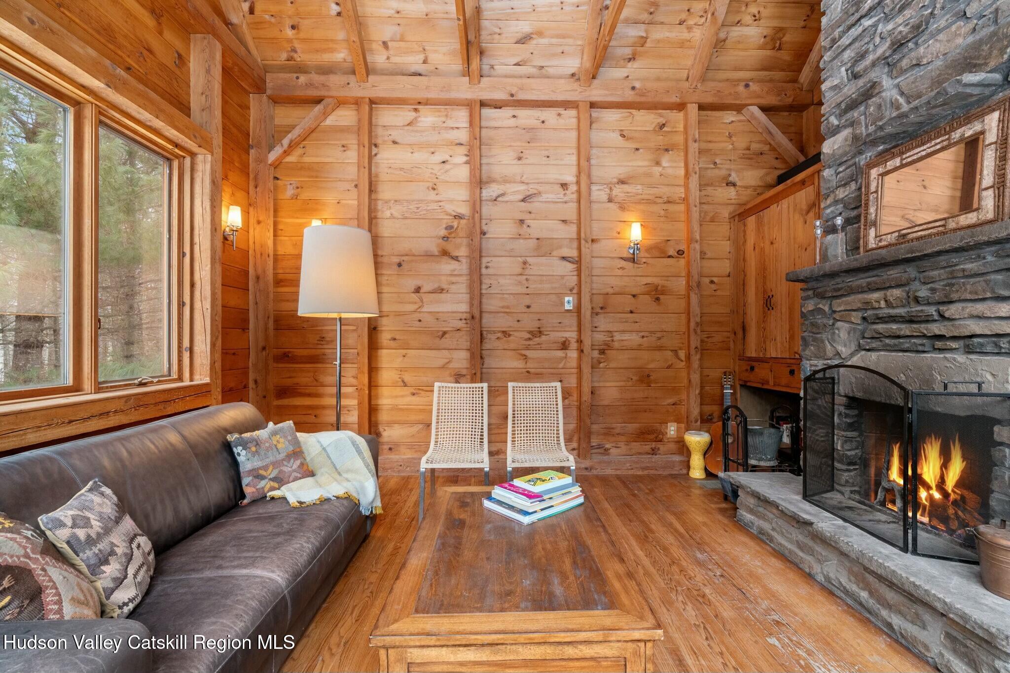 250 Macdaniel Road Woodstock, NY 12498 - Photo 7 of 39 a outdoor living space with patio furniture and a fireplace