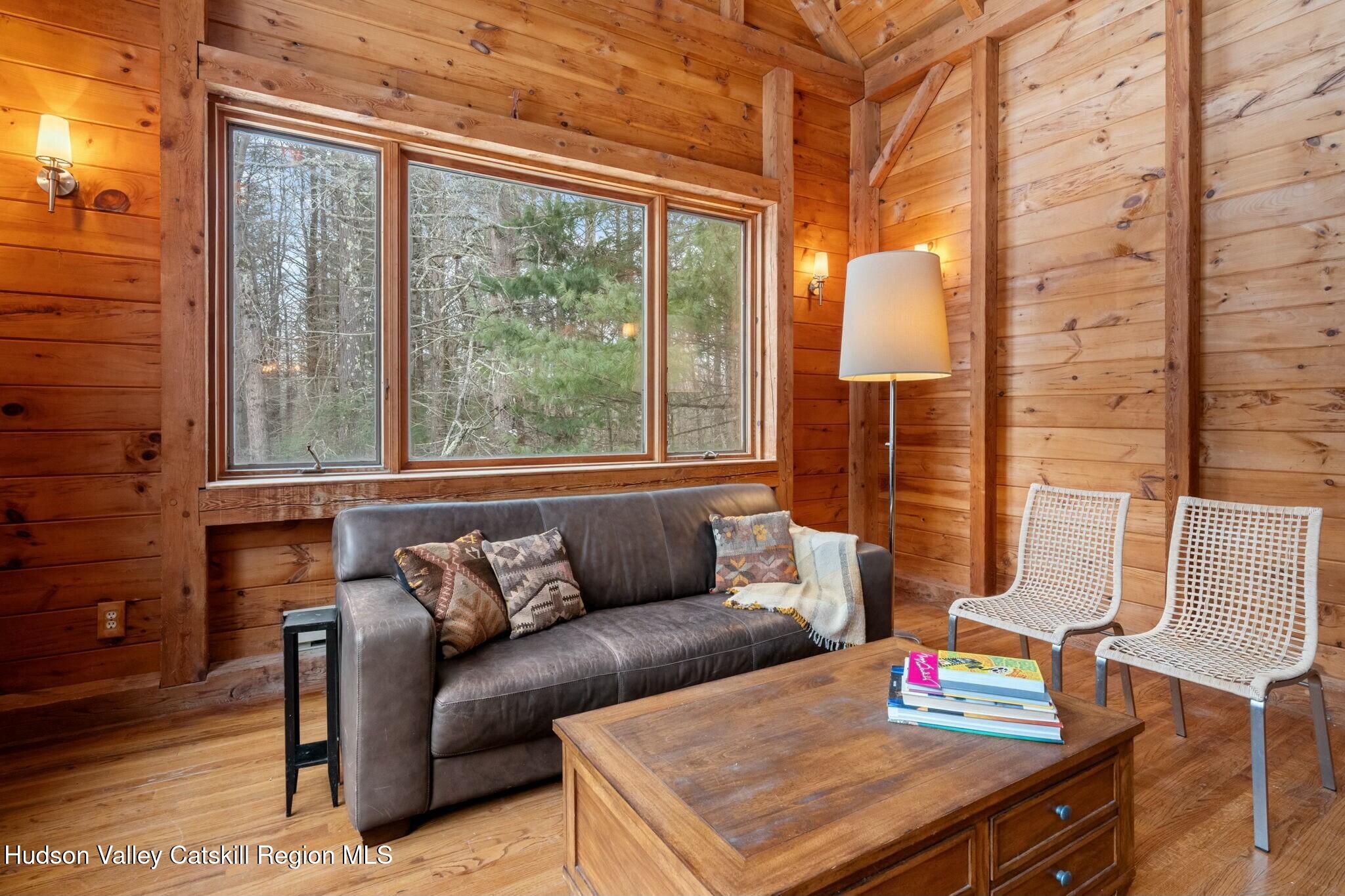 250 Macdaniel Road Woodstock, NY 12498 - Photo 8 of 39 a living room with furniture and a window