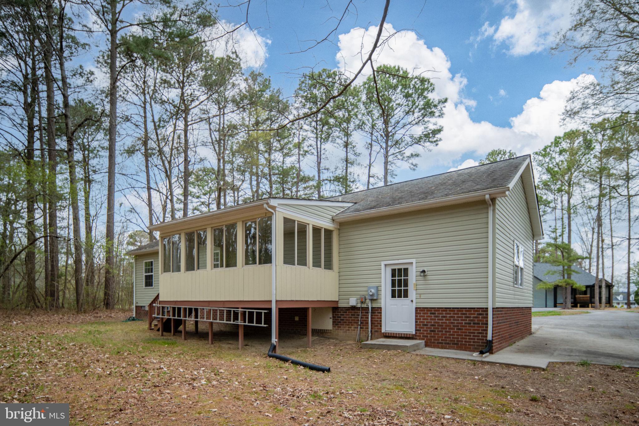 67 Stern Way Montross, VA 22520 - Photo 2 of 74 a view of a house with a yard and sitting area