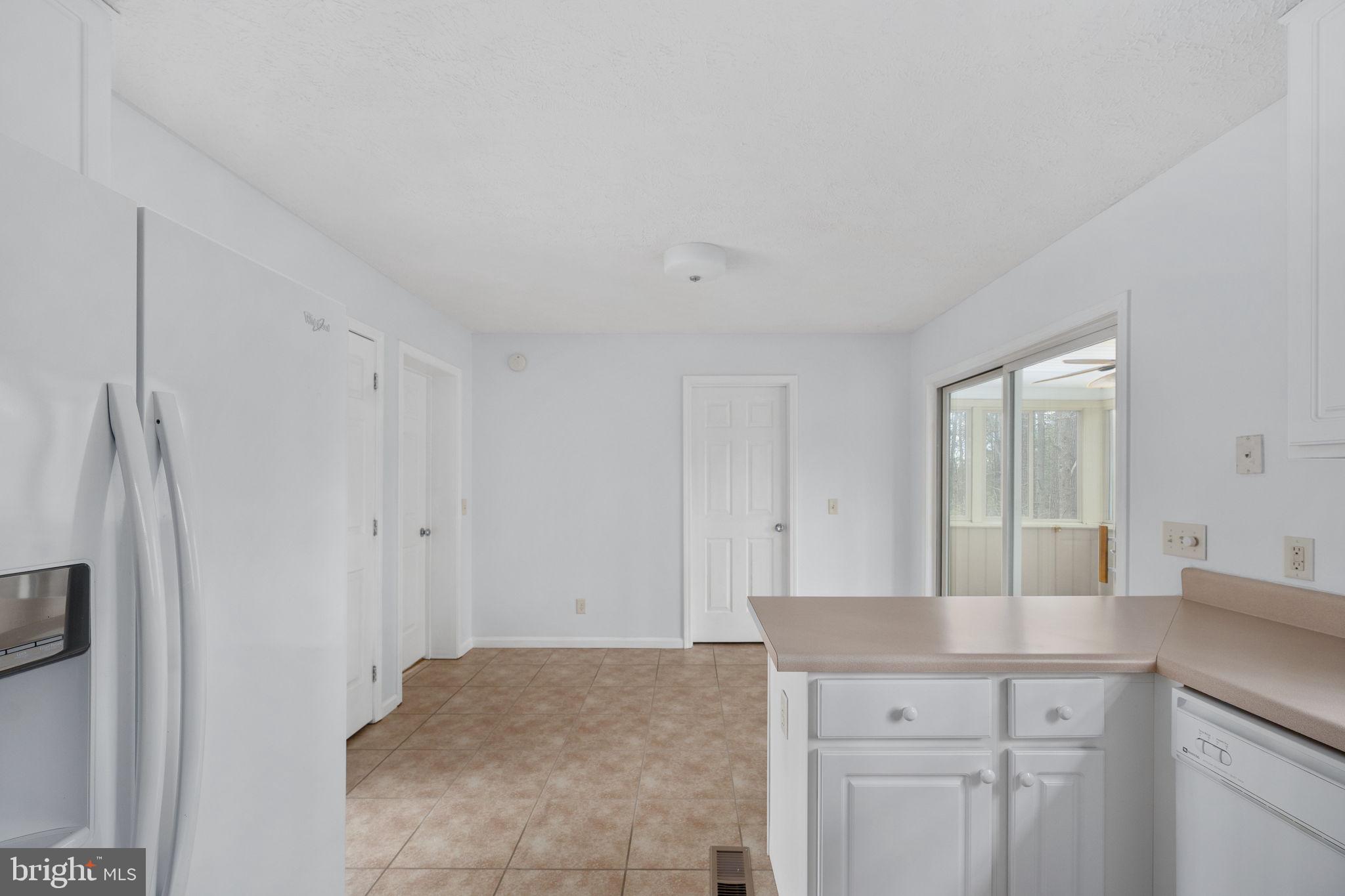 67 Stern Way Montross, VA 22520 - Photo 22 of 74 a kitchen with stainless steel appliances granite countertop a refrigerator and a sink