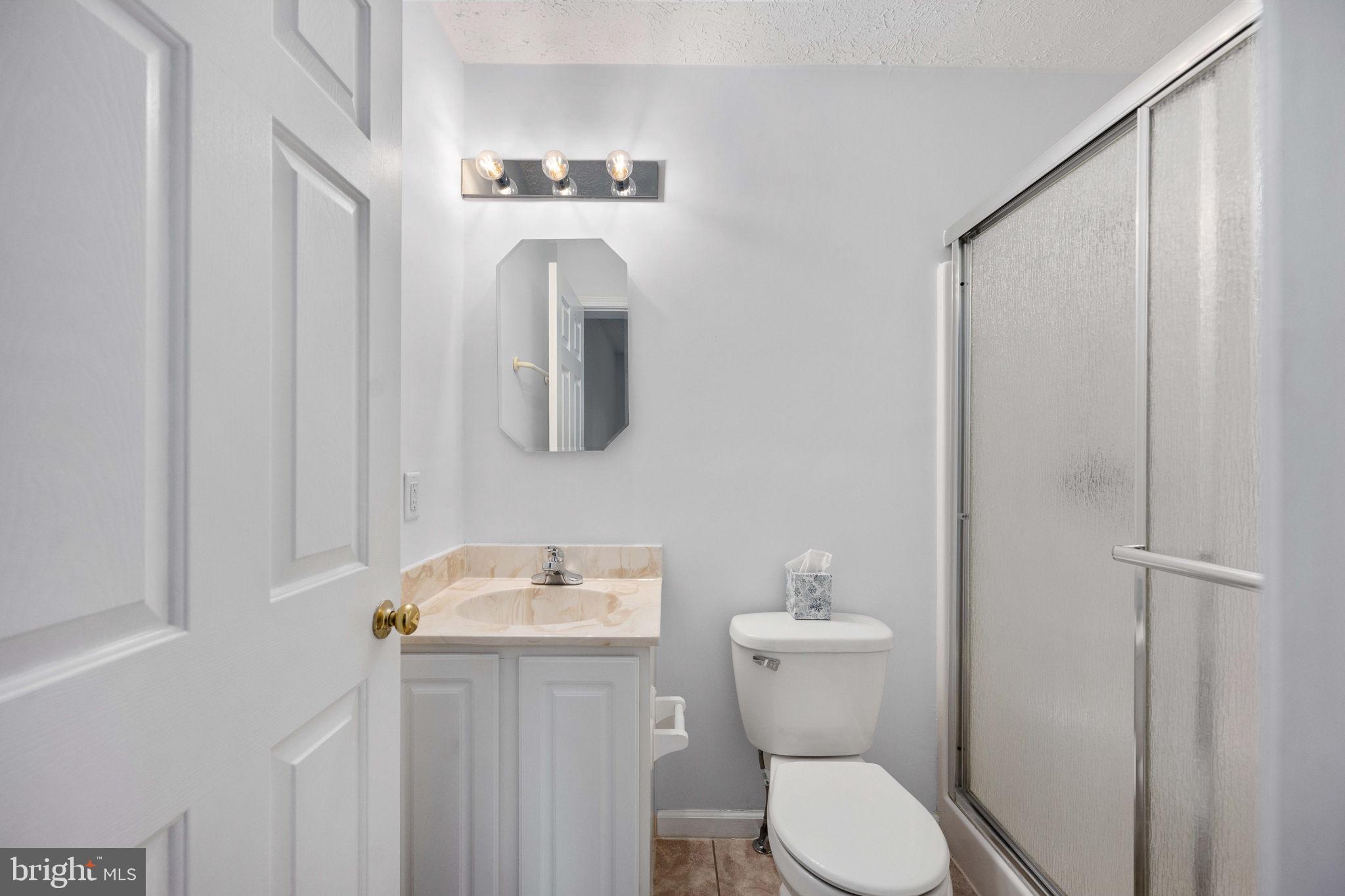 67 Stern Way Montross, VA 22520 - Photo 33 of 74 a white toilet sitting next to a bathroom sink