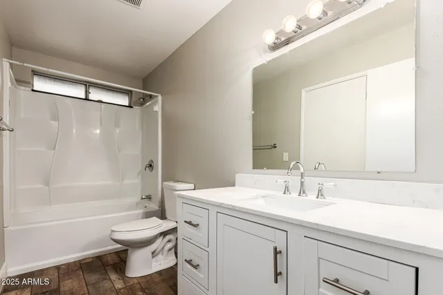 a bathroom with a sink a toilet and a bathtub
