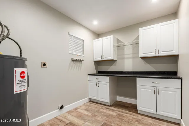 a kitchen with stainless steel appliances granite countertop a sink and a stove