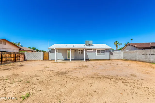 a view of a house with a snow in the yard
