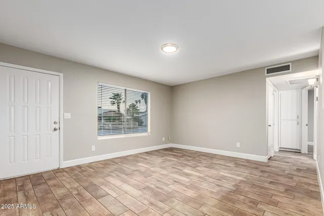 a view of an empty room with a window