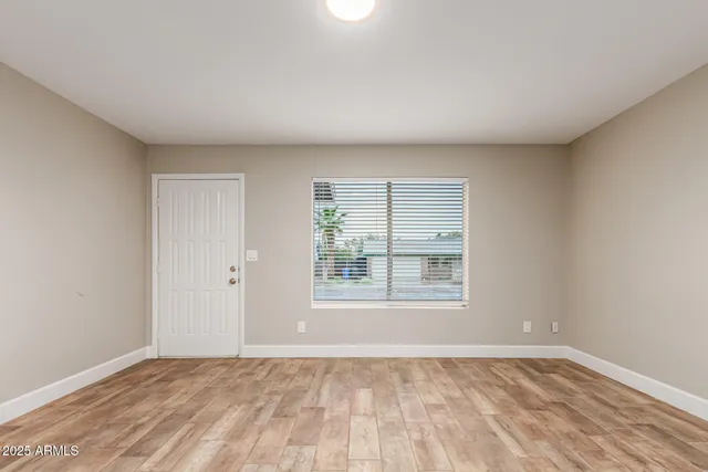 a view of an empty room with a window