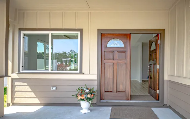 a front view of a house with a dining space and a window