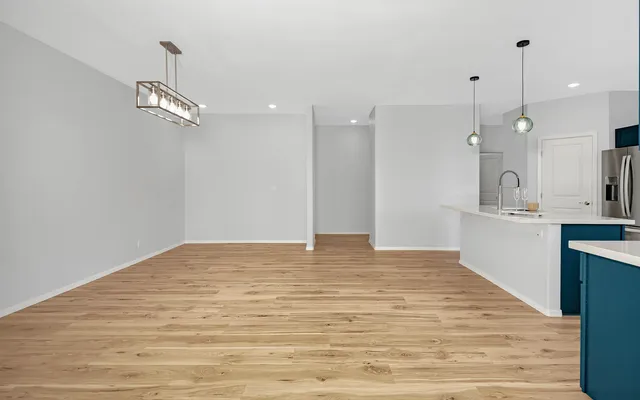 a view of kitchen with wooden floor