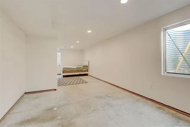 a bed room with a bed and a car