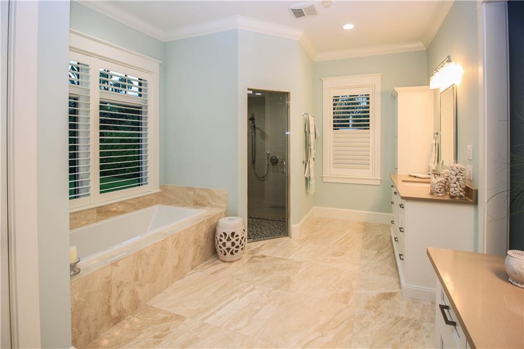 14 Middle Road Stuart, FL 34996 - Photo 21 of 33 a bathroom with a bathtub and a shower