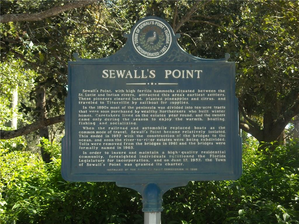 14 Middle Road Stuart, FL 34996 - Photo 29 of 33 a sign that is sitting on a street