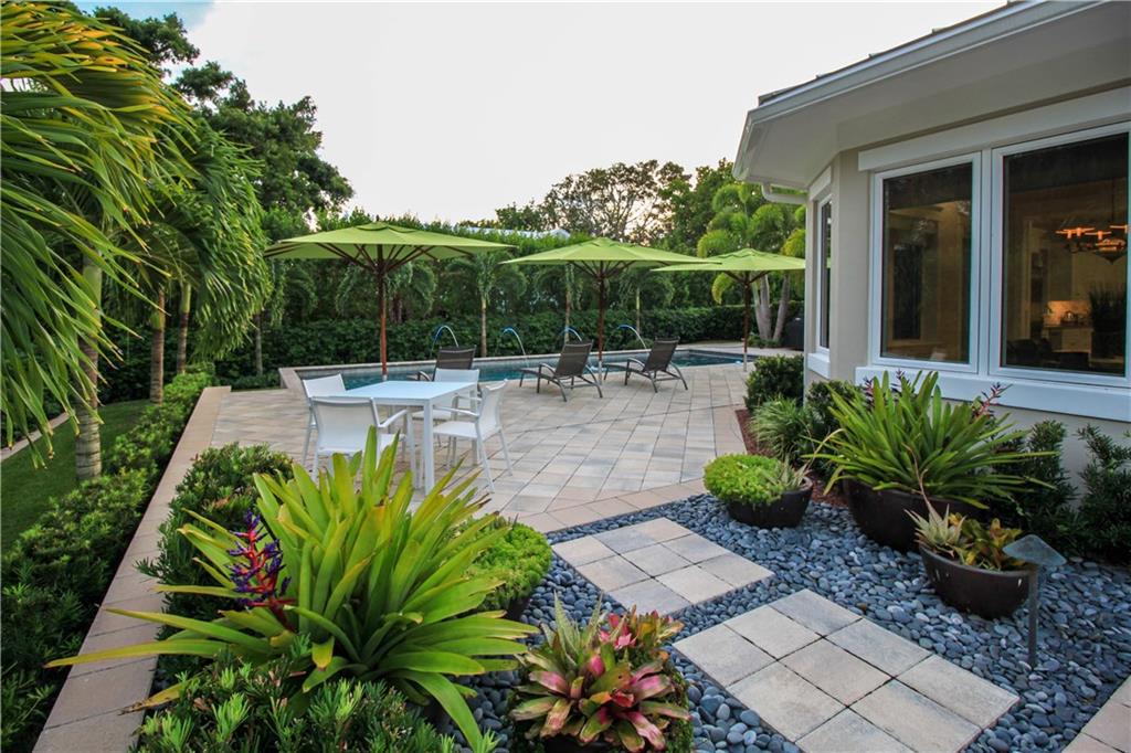 14 Middle Road Stuart, FL 34996 - Photo 5 of 33 a view of a backyard with sitting area