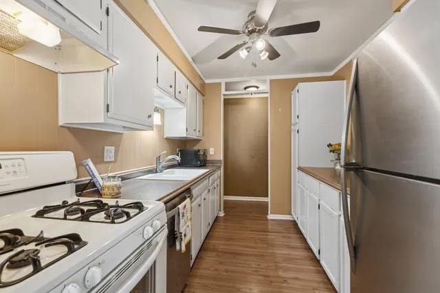 a kitchen with a stove and a refrigerator