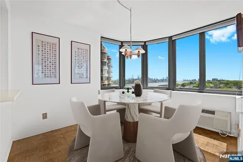 a view of a dining room with furniture window and outside view